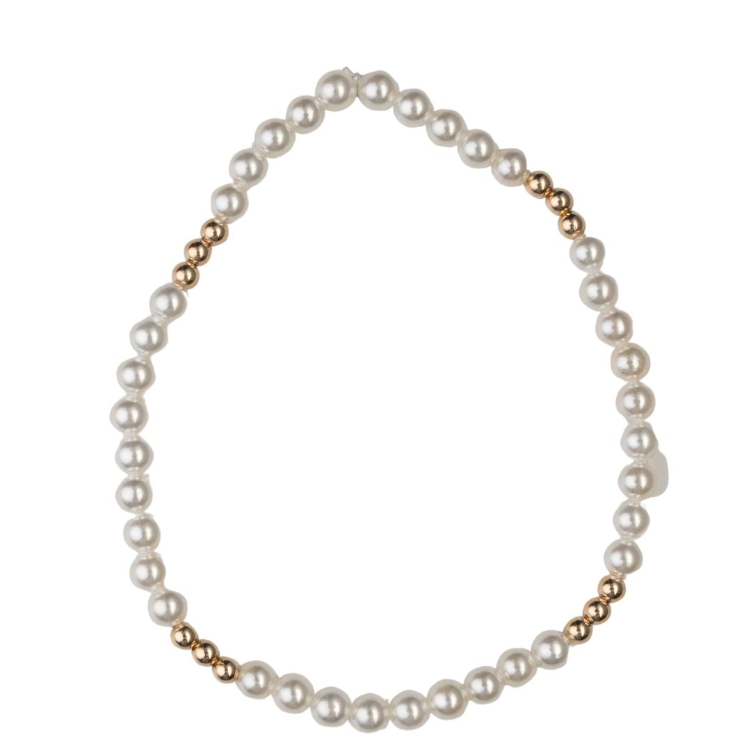 Ali & Bird shell pearl bracelet with gold-toned bead accents on a white background