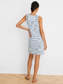 Woman wearing a sleeveless dress with a white background