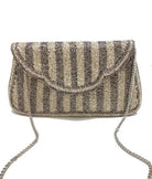 A beaded clutch bag with vertical stripes in beige, brown, and black, featuring a silver chain strap, shown against a plain white background.