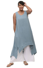 woman wearing blue sleeveless dress