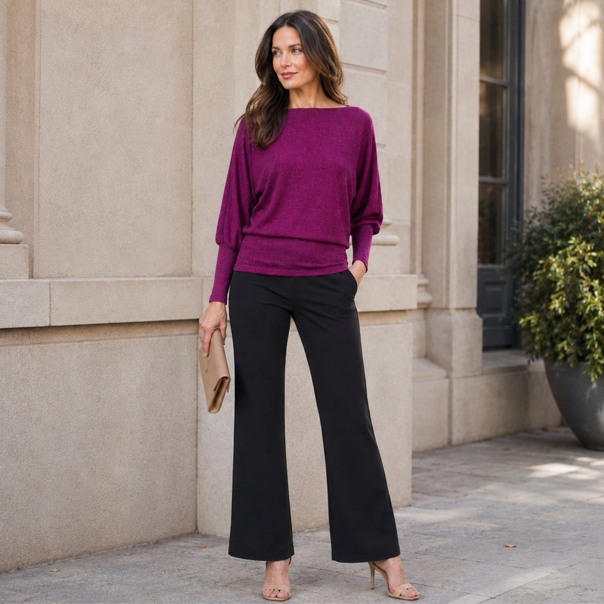 Model wearing the Clara Sunwoo magenta boat neck blouson sweater, styled lifestyle view