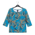 Clara Sunwoo turquoise and brown leaf print top laid flat