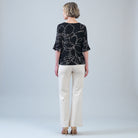 Back view of the Clara Sunwoo floral foiled knit top