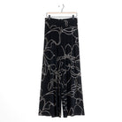Clara Sunwoo black and taupe floral foiled palazzo pant laid flat