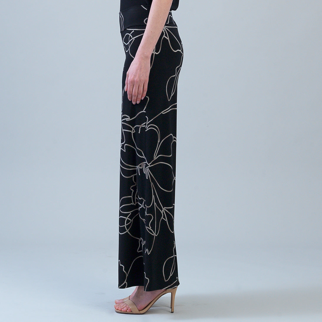 Side view of the Clara Sunwoo floral palazzo pant showing the wide leg