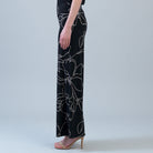Side view of the Clara Sunwoo floral palazzo pant showing the wide leg