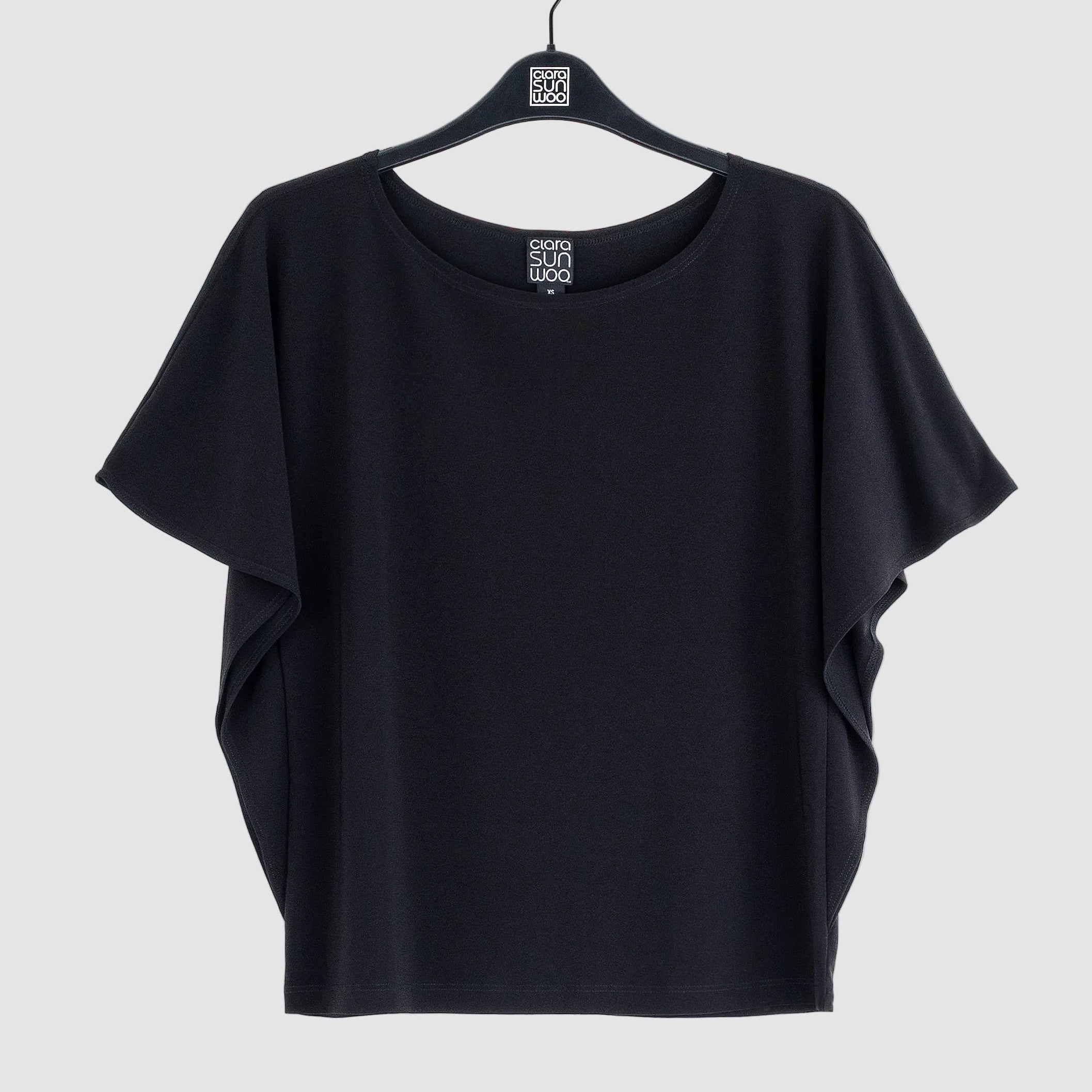 Clara Sunwoo black flutter sleeve top laid flat