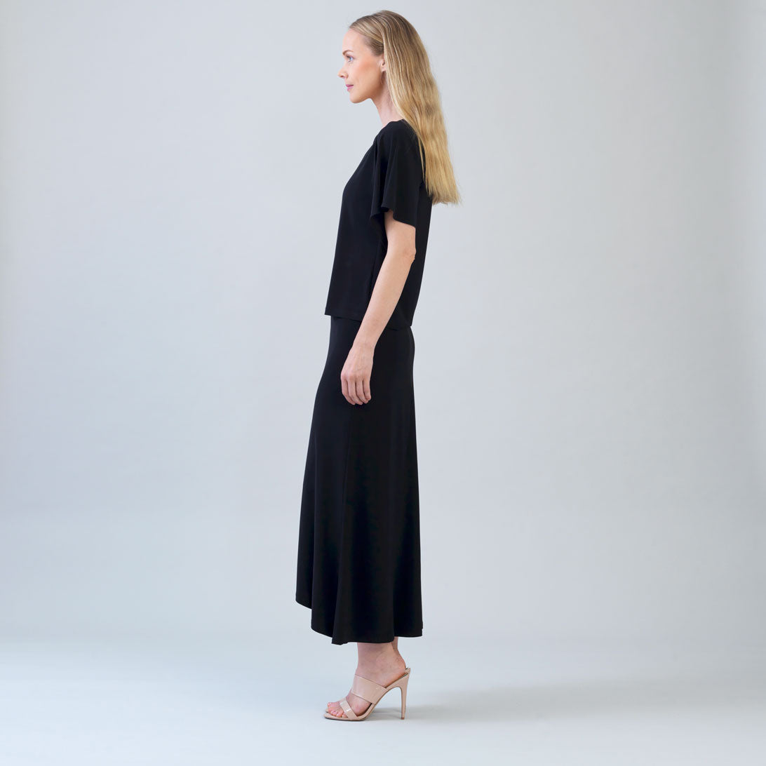 Side view of the Clara Sunwoo black top showing the flutter sleeve