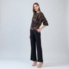 Side view of the Clara Sunwoo black and brown geo print top