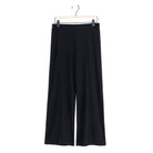 Clara Sunwoo black kick front slit ankle pant laid flat