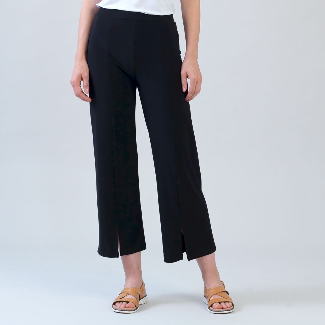 Clara Sunwoo relaxed kick front slit ankle pant in black, front view