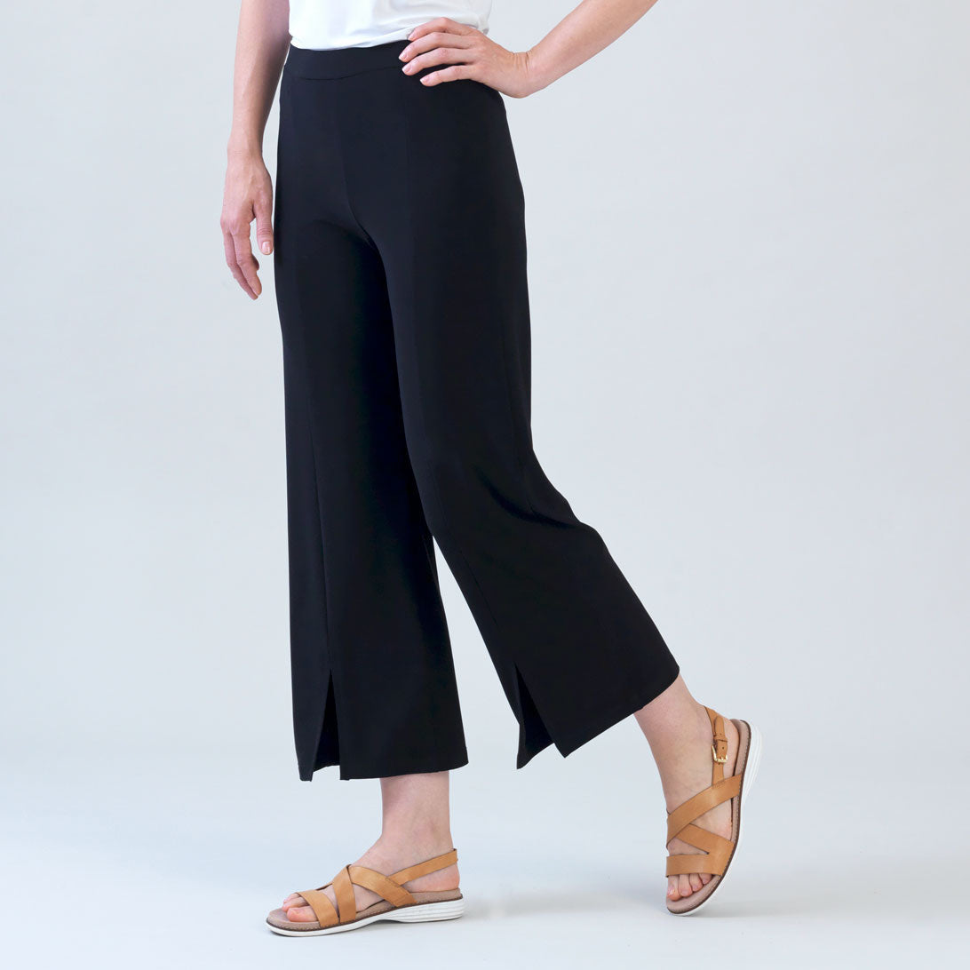 Side view of the Clara Sunwoo black kick slit ankle pant