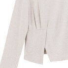 Close-up of the stitch overlay detail on the natural lounge knit