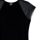 Close-up of the sheer mesh cap sleeve on the black Clara Sunwoo dress