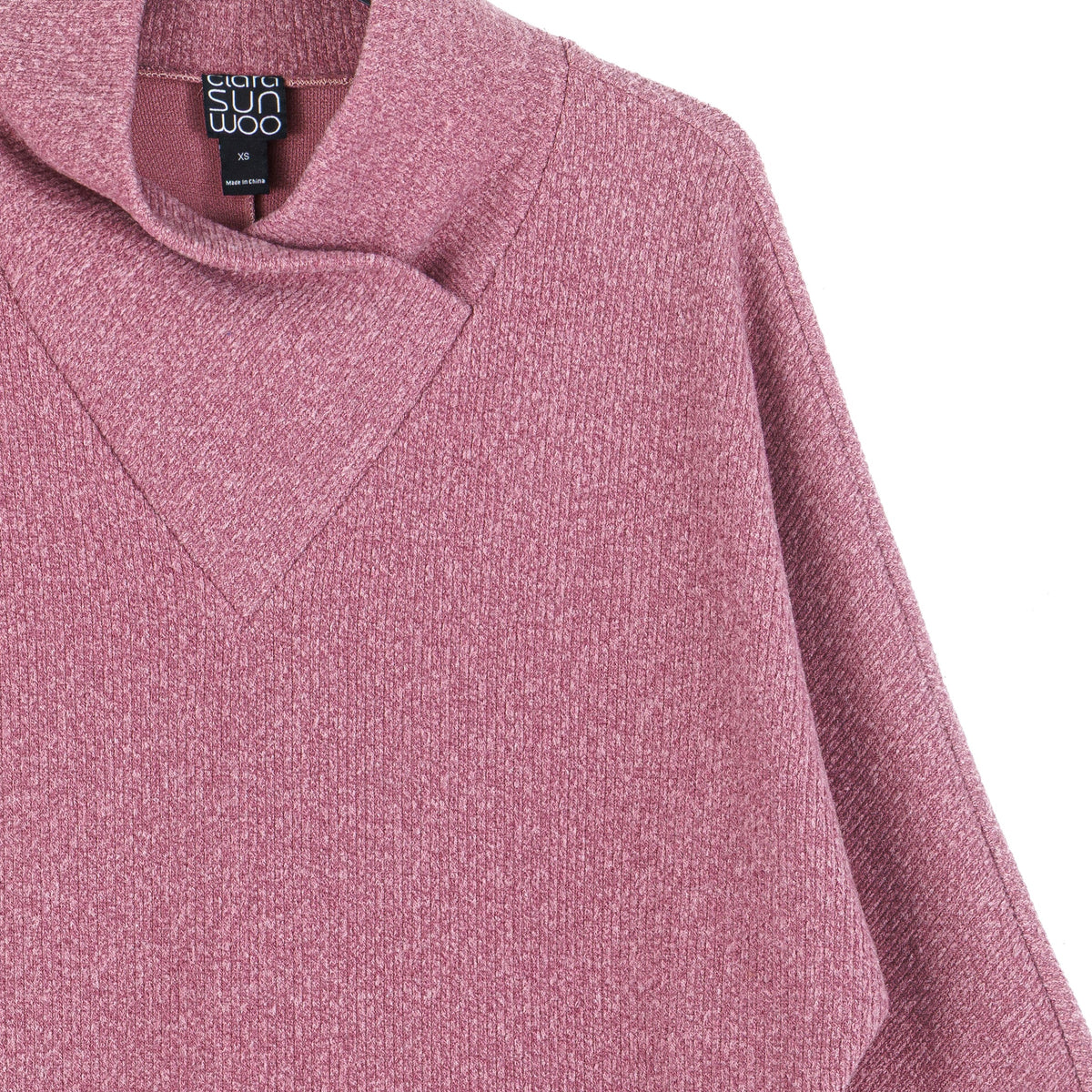 Close-up of the crossover petal neckline in mauve ribbed knit