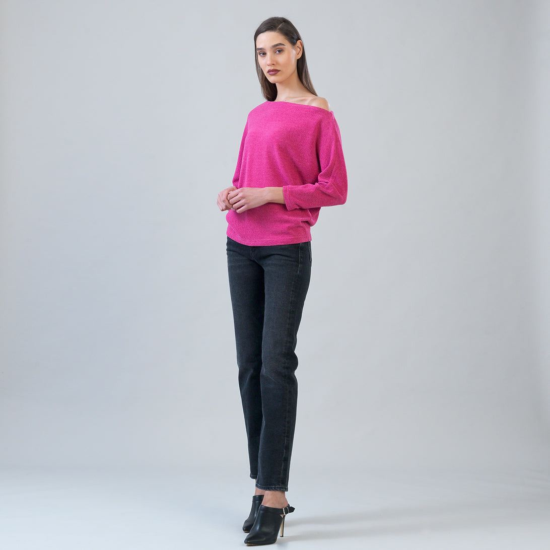 Side view of the Clara Sunwoo fuchsia plush sweater showing the dolman sleeve
