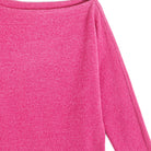 Close-up of the brushed plush knit in fuchsia