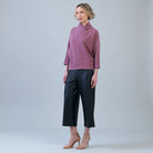 Side view of the Clara Sunwoo mauve ribbed sweater showing the drop shoulder