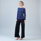 Alternate front view of the Clara Sunwoo track stripe top