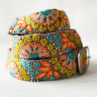 Decorative belt with floral patterns on a grey background