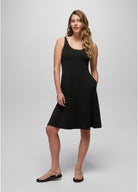 Woman wearing a black dress on a white background