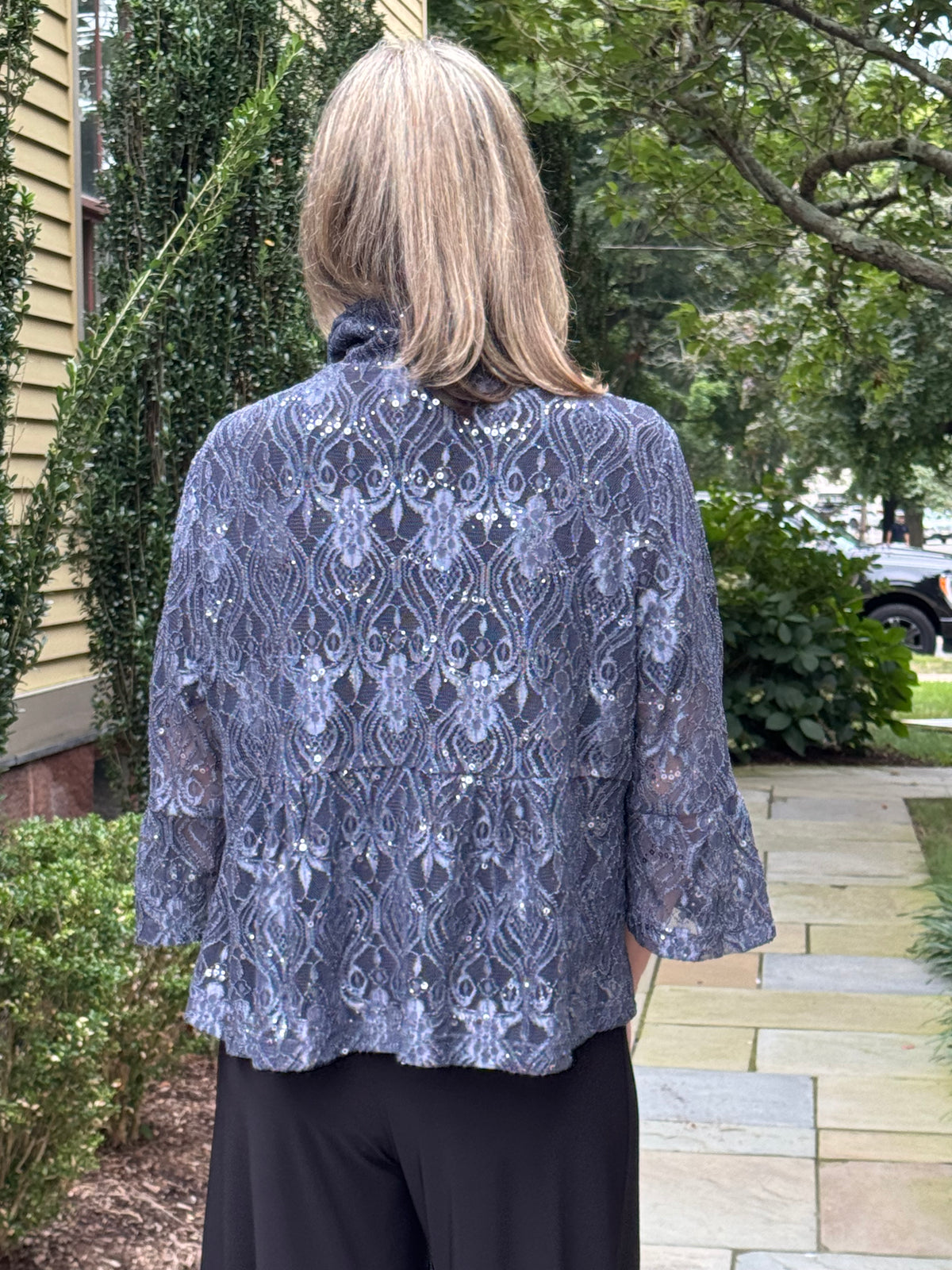 Damee Sequin Lace Peplum Jacket in charcoal lace, back view with high neck and three-quarter sleeves