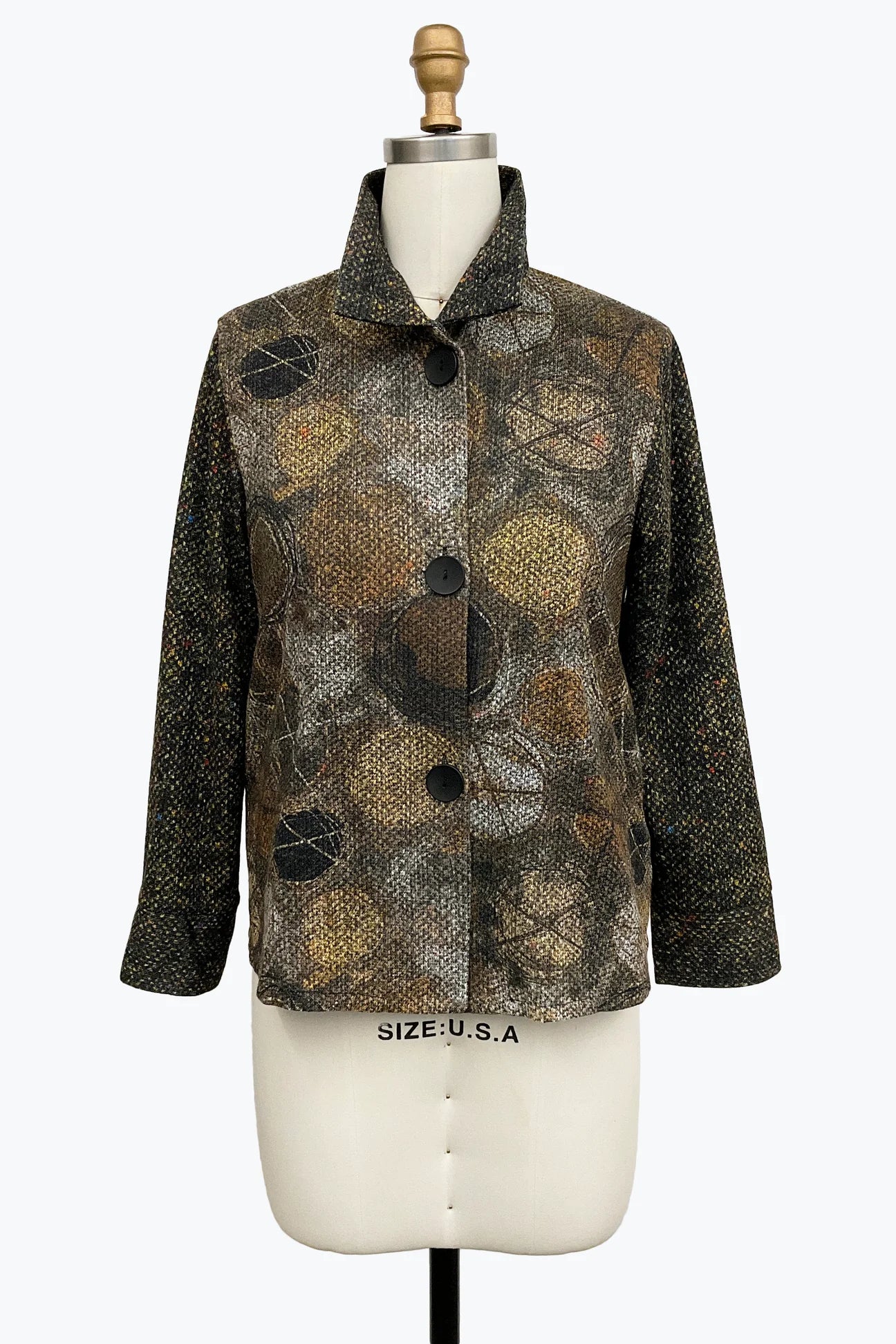 A women's long-sleeve button-front jacket displayed on a cream dress form mannequin. The jacket features a mixed abstract pattern with snakeskin-style brown and black patterns on the front panel and a solid black textured fabric on the sleeves.