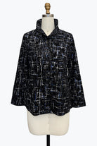 A black and white textured tweed jacket with a high collar and three-quarter sleeves, displayed on a cream-colored dress form mannequin against a plain white background.