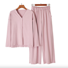 Dusty pink modal V-neck button top and wide-leg pants on hangers