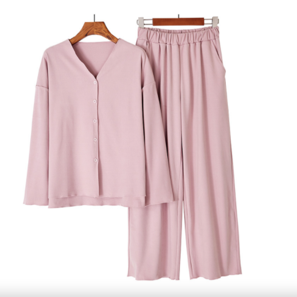 Dusty pink modal V-neck button top and wide-leg pants on hangers