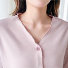 V-neck and button front of the dusty pink modal pajama top