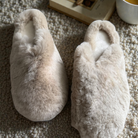 Side angle of the fluffy beige rabbit fur slippers