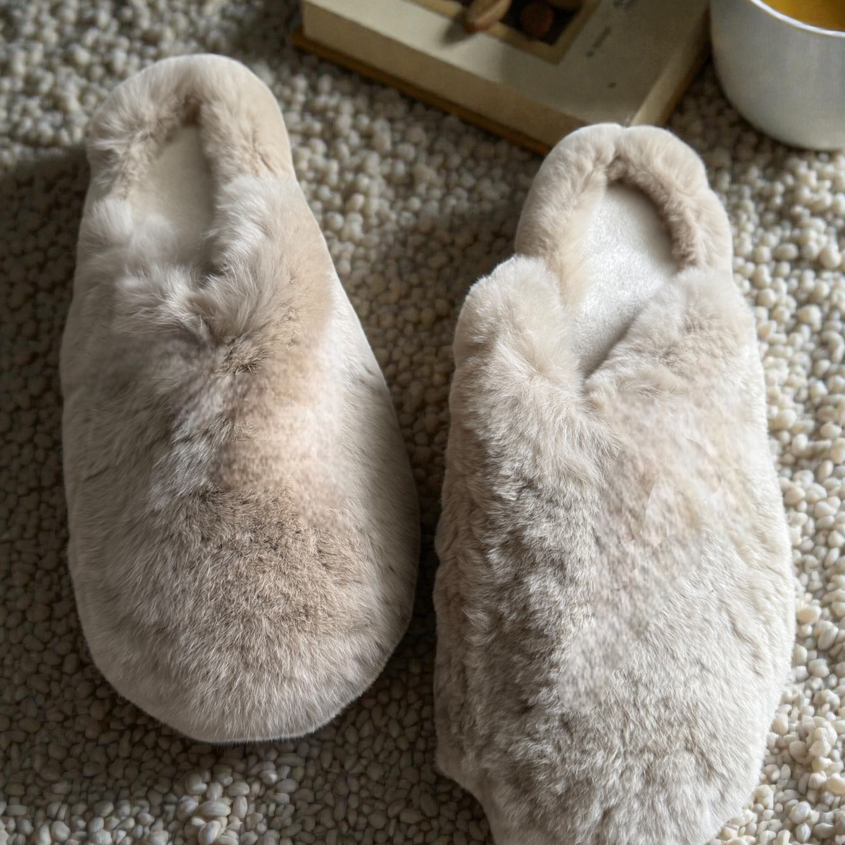 Side angle of the fluffy beige rabbit fur slippers
