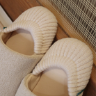 Close-up of the cozy knit back on the tan house slippers