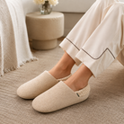 Tan quiet knit house slippers worn with lounge pants