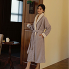 Woman wearing the lavender sherpa lined robe, full length