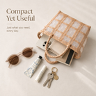 Beige woven tote shown with sunglasses, keys, and everyday essentials
