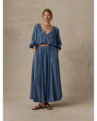 Faherty Brand Tried & True Chambray Nera Skirt in River Mist Wash — women's flowy maxi skirt styled with matching chambray top and leather sandals

