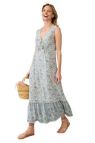 Faherty Eden Dress in blue floral print on ivory, tiered maxi with ruffled hem, side view walking