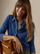 Faherty Sunwashed Knit Shirt in Medium Indigo Wash, styled lifestyle view