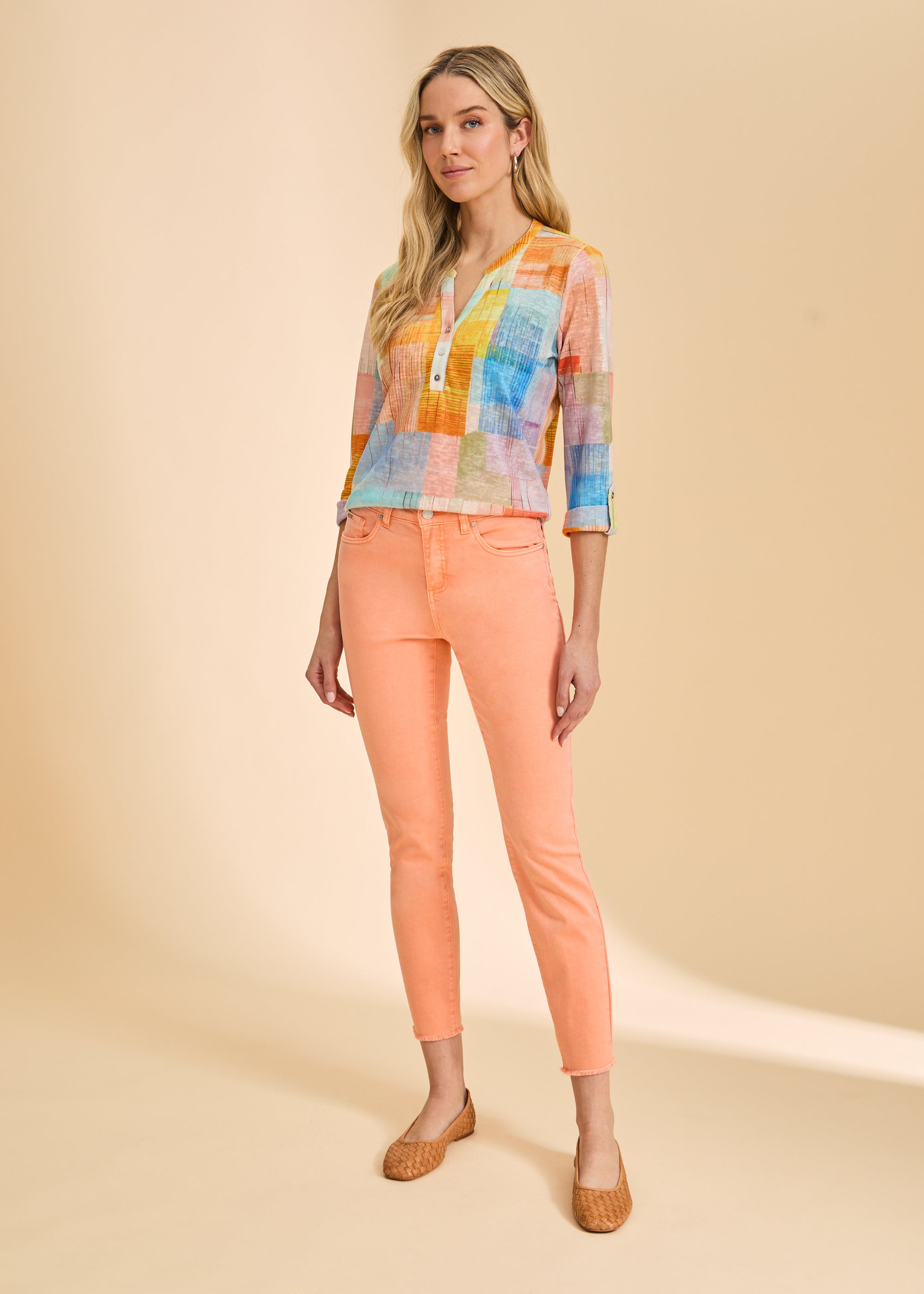 FDJ Olivia Slim Ankle jeans in cantaloupe, full-length view styled with a color block top