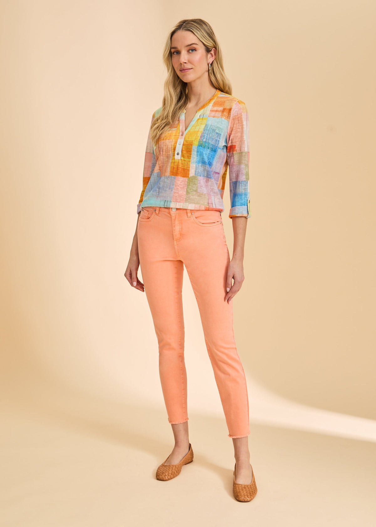 FDJ Olivia Slim Ankle jeans in cantaloupe, full-length view styled with a color block top