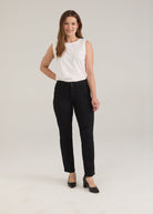 Model wearing FDJ Petite Olivia Straight Leg Jeans in black with a white sleeveless top and black heels, full-length front view