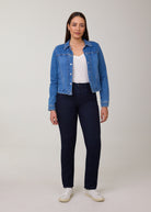 Model wearing FDJ Petite Suzanne Straight Leg Jeans in Pleasant dark wash with a denim jacket, white tee and white sneakers, full-length front view