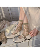 Sheer lace socks styled with Mary Jane flats