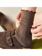 Brown crew socks styled with clogs