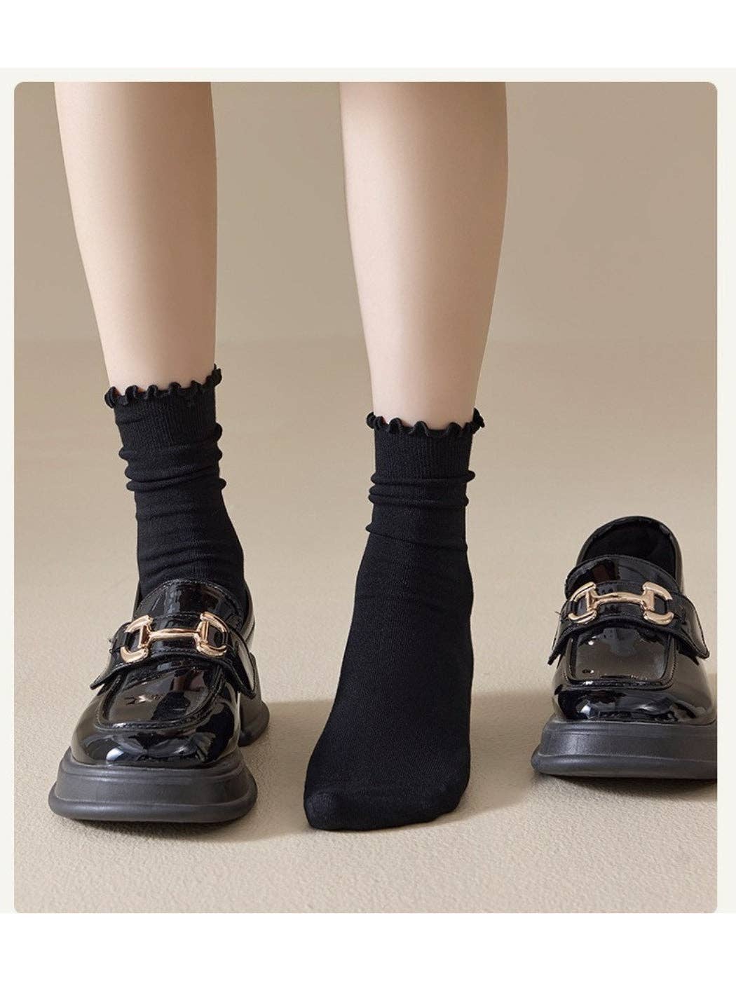 Black crew socks styled with loafers