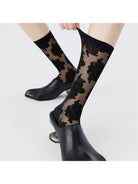 Black flocked floral socks styled with heels