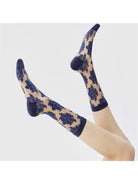 Blue flocked floral sheer socks on foot