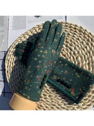 Green floral touchscreen gloves styled on a woven basket